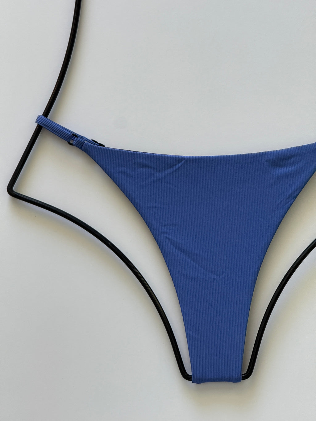Close-up of ribbed Sapphire blue fabric texture on Acacia Ralphy Bikini Bottom.